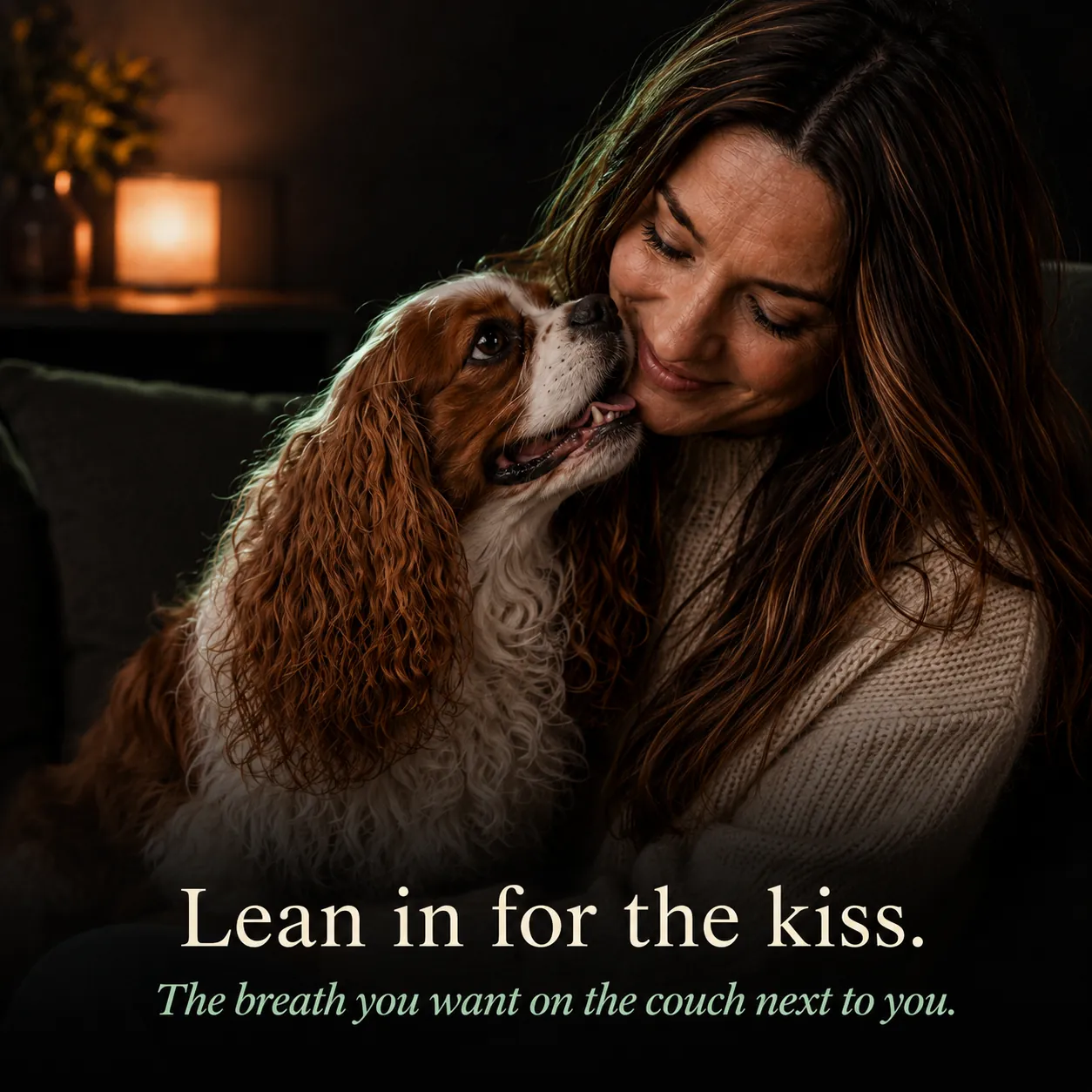 Lean in for the kiss: woman nose-to-nose with her happy Cavalier, the breath you want on the couch next to you